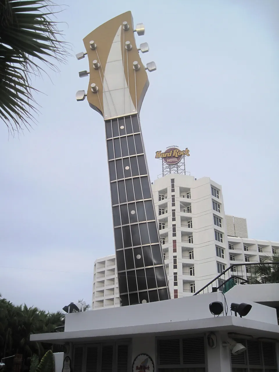 Photo: the Hard Rock Hotel Pattaya, home of Hard Rock Cafe: its giant guitar sign in front of the white hotel tower on Beach Road